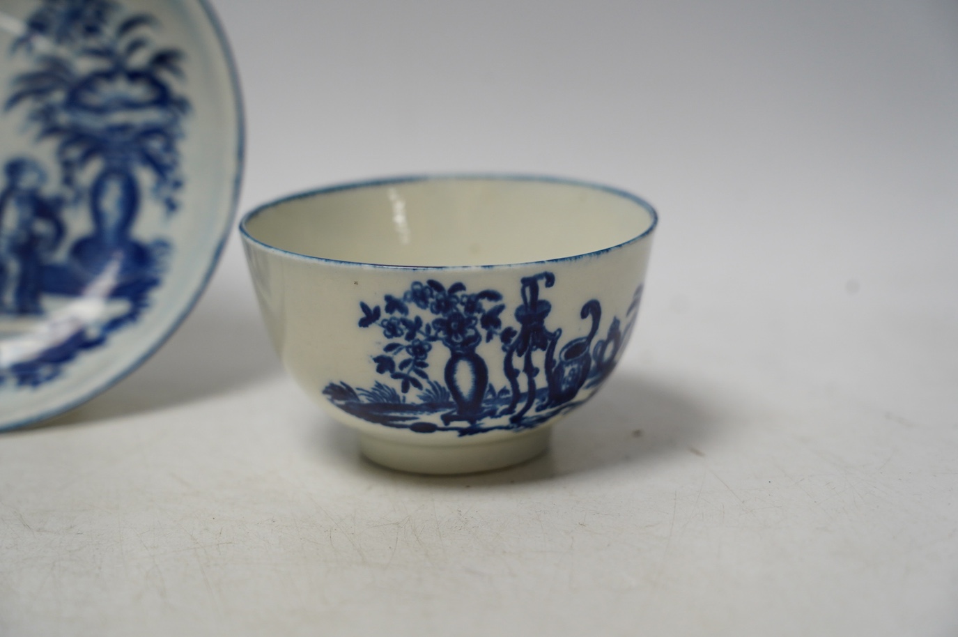 A pair of Barr Flight & Barr coffee cans and a group of Worcester to include a blue and white tea bowl and saucer and another teabowl. Condition - good